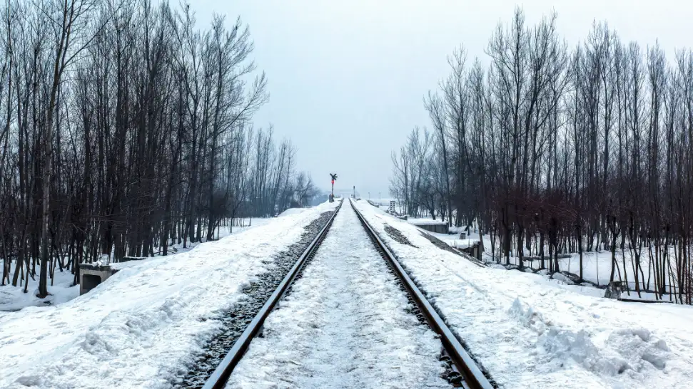 Jammu Baramulla Kashmir Valley train snow capped mountains