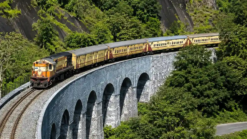Kollam Sengottai chord line train Western Ghats waterfalls