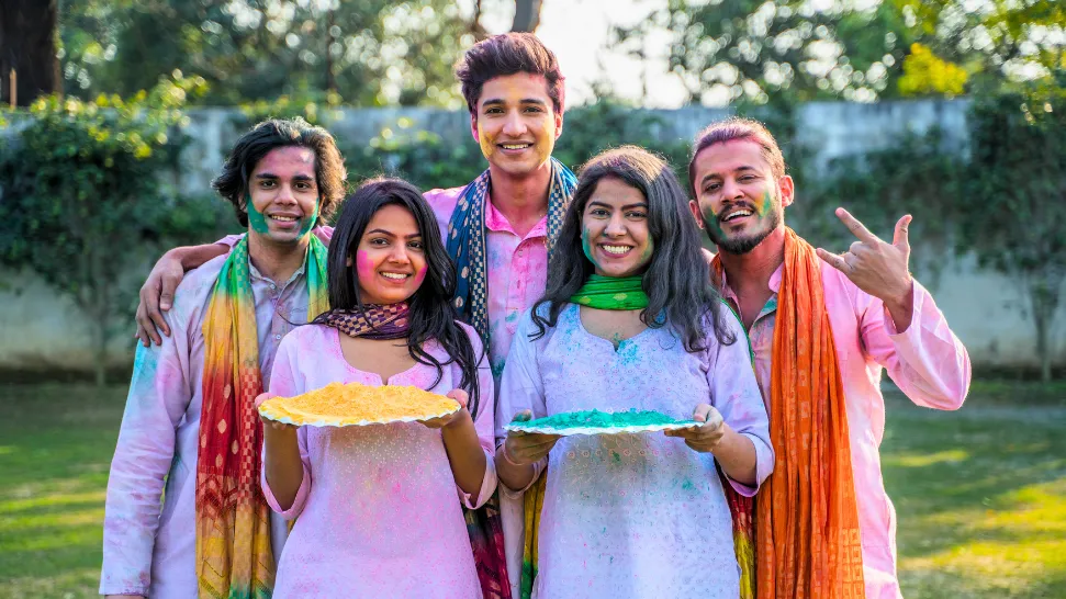 People celebrating Holi in Mathura and Vrindavan with vibrant colours, music and joyful festivities