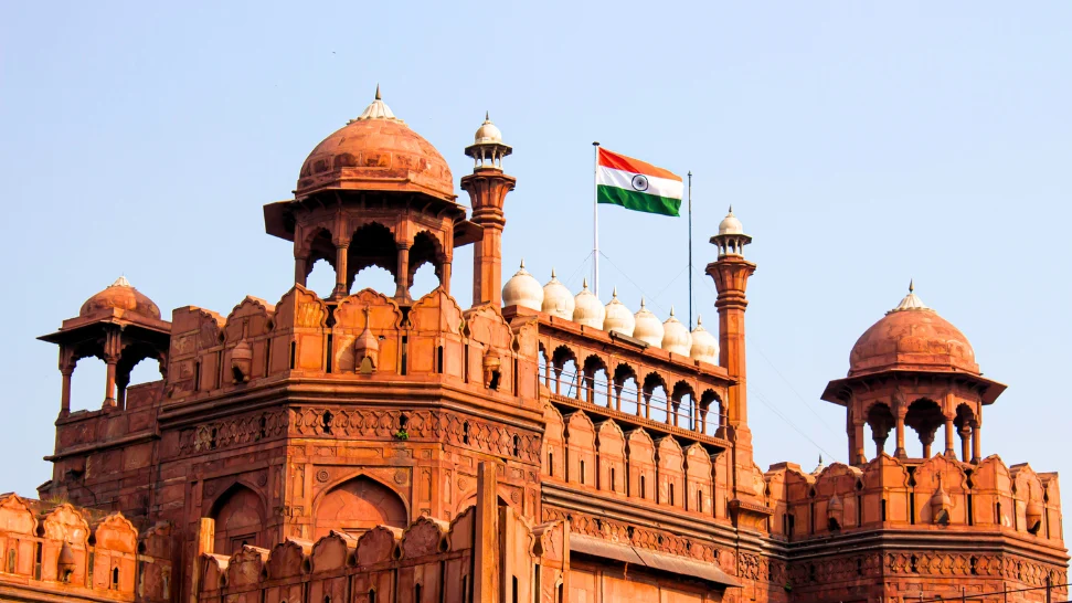 Independence Day celebration in India with the tricolour flag being hoisted and patriotic festivities