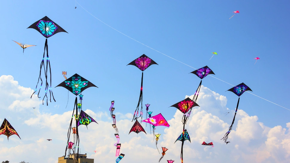 Makar Sankranti celebration in Ahmedabad with colourful kites filling the sky and festive activities