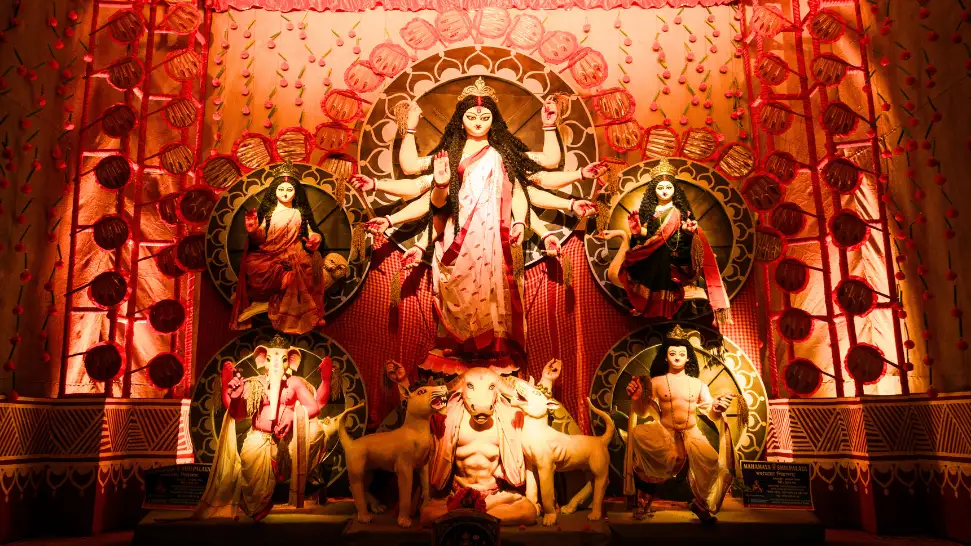 Navratri garba celebration in Gujarat and decorated Durga Puja pandals in Kolkata
