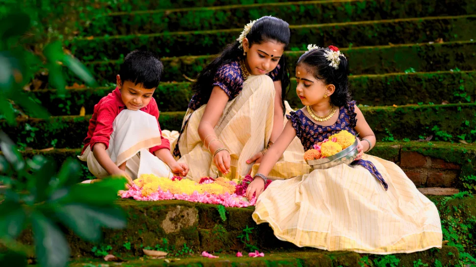 Onam celebration in Kerala with a colourful pookalam, traditional decorations and festive cultural activities