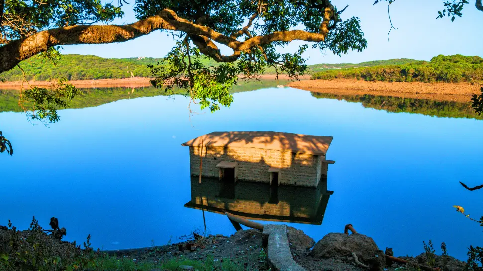 Boating at the scenic Venna Lake surrounded by lush greenery in Mahabaleshwar