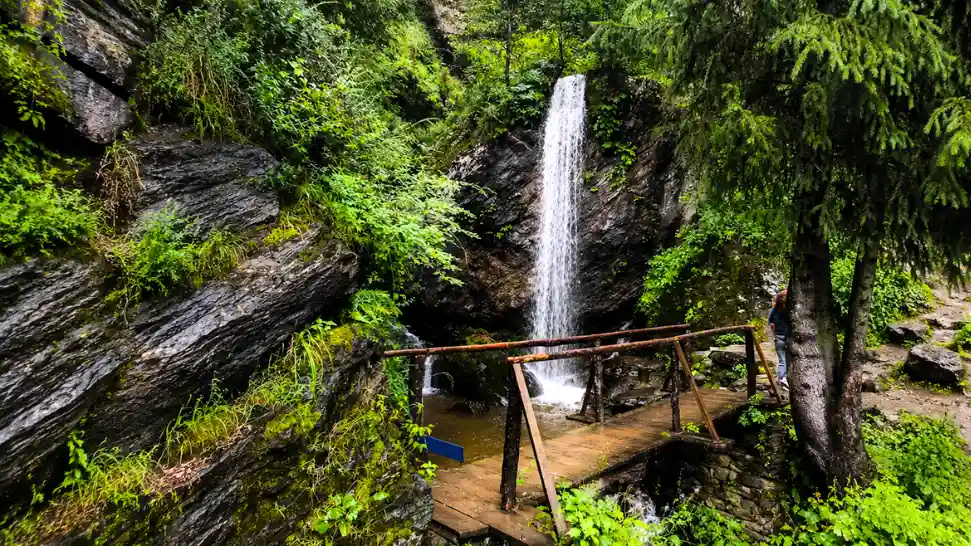 Beautiful Jana Waterfall surrounded by forests and apple orchards