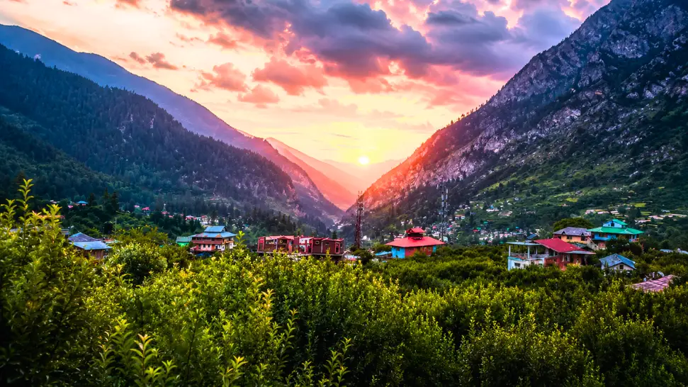 Apple orchards and traditional wooden houses in Kalga Village near Kasol
