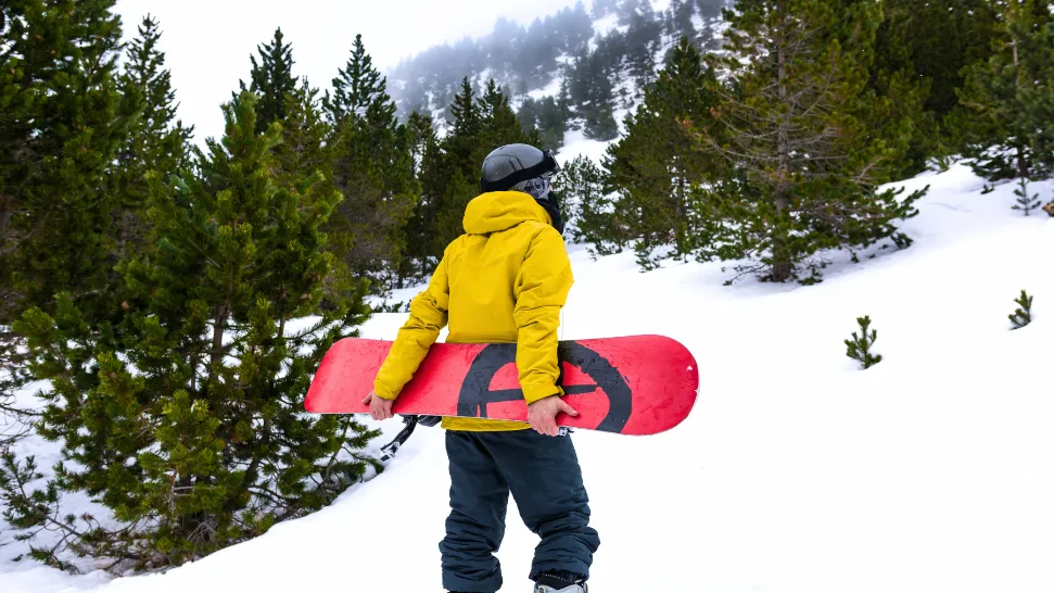 Snowboarding in Manali on snow covered mountain slope